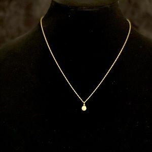 Pearl pendant with gold tone necklace